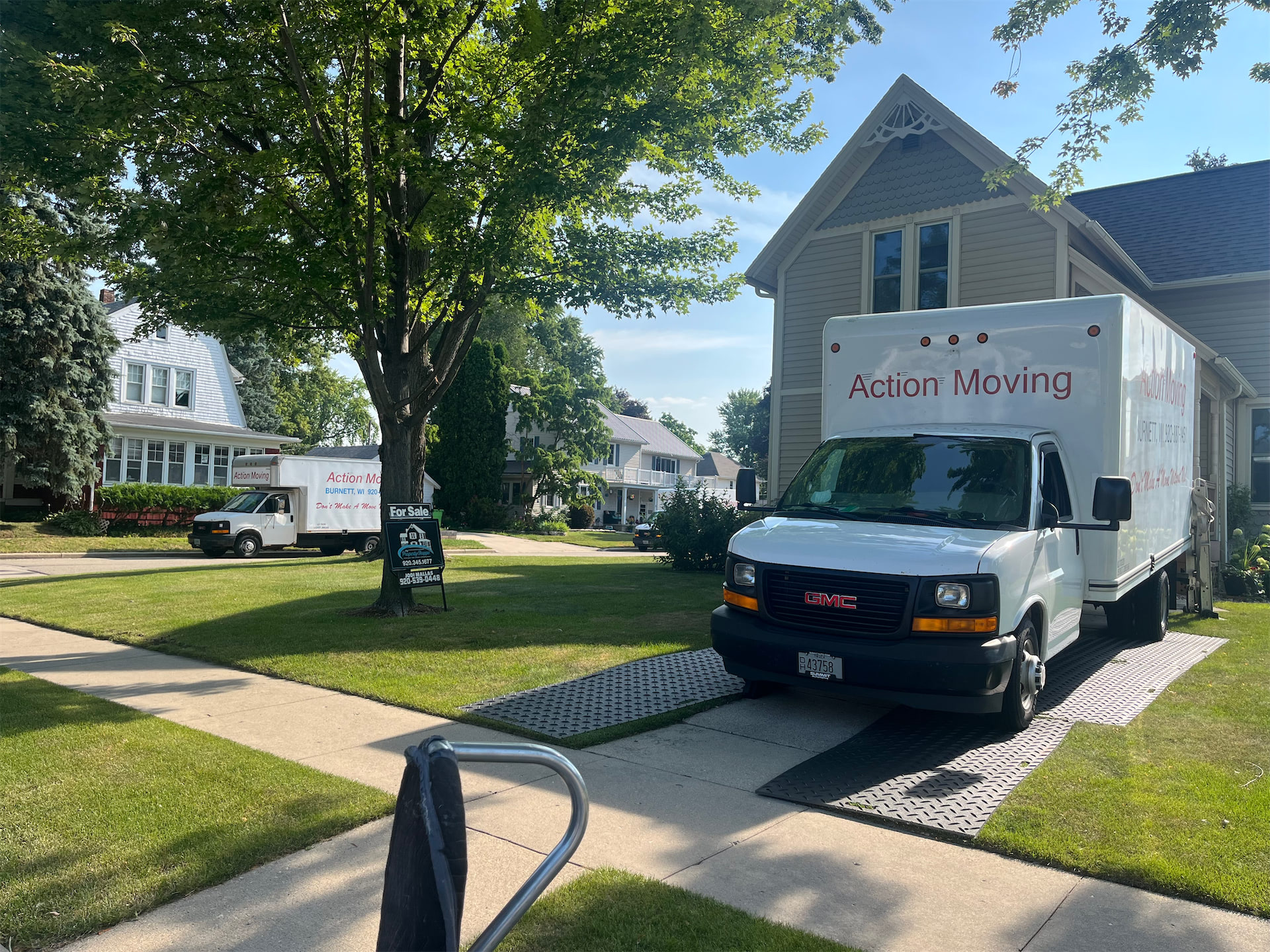 Action Moving trucks parked outside a home on moving day
